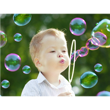 Bubble gun liquid refill bottle with a clear label showing liquid inside