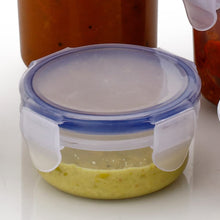 Transparent round food storage container with secure lid and airtight seal.