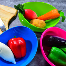 Set of plastic strainers and bowls with handles for food