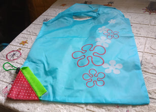 Washable and foldable reusable grocery bags with handles.