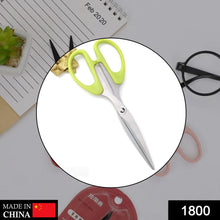 the stainless steel scissors, highlighting the plastic handle grip and sharp blades